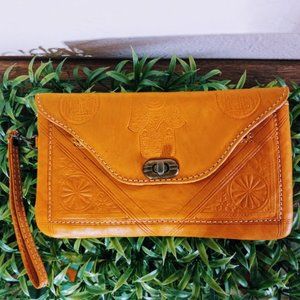 Mustard yellow leather embossed clutch